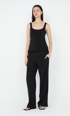 Crafted from a delicate silk, the BEC + BRIDGE Era Pant are an easy-to-wear classic style. Designed to sit on the mid waist in a relaxed, wide-leg silhouette, the pants feature an elasticated waistband and inseam pockets at the side seam. FIT: Designed to fit on the mid waist in a relaxed silhouette, pants are accessed via pullover styling. SIZING: True to size, select your normal size. Model is 179cm/ 5'10.5" wearing an AU 8 / US 4. Designed + made in Australia Bec Bridge, New Pant, Dresses Backless, Brides And Bridesmaids, New Tops, Dress Cuts, Guest Dresses, Invisible Zipper, Wedding Suits