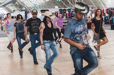 a group of young people dancing in a mall