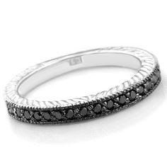 a white gold ring with black diamonds