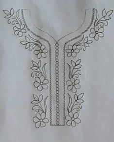 an embroidered shirt with flowers and chains on it