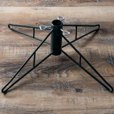 a black metal object on a wooden floor