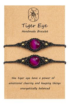 the tiger eye bracelet has two purple stones on it and is attached to a black cord