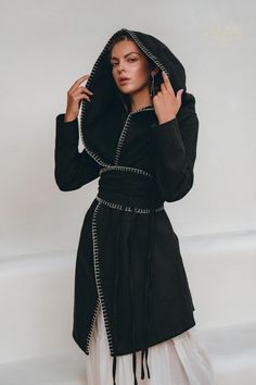 This beautifully designed coat is made in a super elegant form with elements of hand embroidery, thick wide belt at the waist, also hand-embroidered. This unique high low hem hoody is made of homespun thick linen fabric with the use of viscose lining. Our cozy coat has a wide hood that, if desired, transforms into a wide stylish collar. We recommend this product as a must-have in the wardrobe of any fashionista! It perfectly matches on top of our dresses, with simple linen trousers. This boho co Hand-stitched Long Sleeve Outerwear For Fall, Bohemian Hand-stitched Outerwear For Winter, Hand-stitched Bohemian Outerwear For Winter, Bohemian Hand-stitched Winter Outerwear, Wrap Cloak, Hooded Kimono, Boho Coat, Boho Plus Size, Cardigan For Women