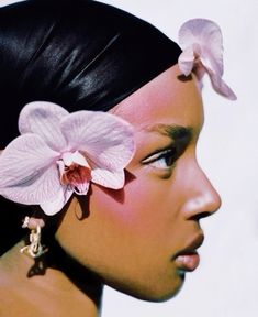 a woman with a flower in her hair