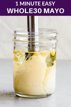 a mason jar filled with homemade mayonnaise and the words, 1 minute easy whole 30