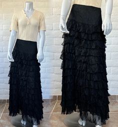 "This is an AMAZING early design (very late 90s or early 00s) from Marrika Nakk, known for her romantic Western wear fashions. The skirt is constructed from cascading black lace ruffles topped with wide fitted waist panel. It's fully lined (just the bottom couple of inches are sheer) and finished with a side zipper. This is a fabulous, versatile piece that could be styled as Western or goth or boho - it would look great so many ways! The label reads Marrika Nakk. Measurements: no tag; this is approx a size medium. The waist measures 30\" (meant to fit a bit low) and the seam at the bottom of the waist panel measures 36\" (would hit at high or mid hip on most). It's 43\" long. Material: no tag; feels like nylon. Condition: freshly hand laundered and in excellent vintage condition. There's a Early 90s Fashion, Lace Maxi Skirt, Black Lace Skirt, Maxi Lace Skirt, Skirt Y2k, Late 90s, Lace Maxi, Maxi Skirts, Lace Ruffle