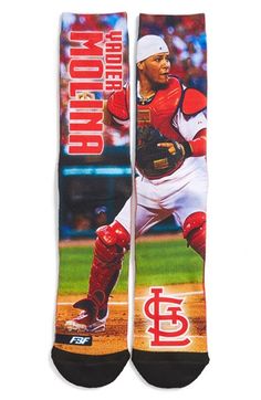 a pair of socks with the image of a baseball player in red and white on it