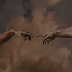 two hands reaching out towards each other with clouds in the background