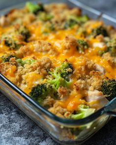 a casserole dish with chicken, broccoli and cheese