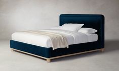 the bed is made up and ready for someone to use it in their home or office