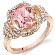 a pink diamond ring with diamonds around it