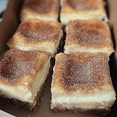 several pieces of cake sitting in a box