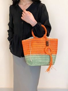 Stay stylish and organized this spring and summer with our Chic and Colorful Woven Tote Bag. Featuring a circular handle design and vibrant colors, this bag is perfect for any occasion. With ample space and a durable woven construction, it's the ultimate accessory for all your needs. Color : Multicolor Type : Straw Bag Bag Size : Large Style : Casual, Vacation Strap Type : Chain Closure Type : Zipper Pattern Type : All Over Print Composition : 60% Polyester, 40% Polyvinyl Chloride Material : Fab Summer Top Handle Shoulder Bag With Large Capacity, Summer Shoulder Bag With Large Capacity And Top Handle, Top Handle Shoulder Bag With Large Capacity For Summer, Large Capacity Top Handle Shoulder Bag For Summer, Casual Handheld Beach Bag With Detachable Handle, Handheld Shoulder Bag For Daily Summer Use, Summer Handheld Shoulder Bag, Large Capacity Top Handle Bags For Summer, Trendy Beach Bag With Detachable Handle And Bucket Shape