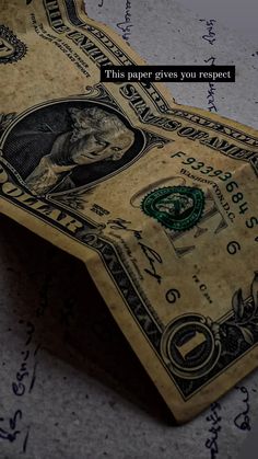 a dollar bill laying on top of a piece of paper with the words, this never gives you respect