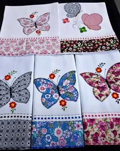 several different types of butterfly napkins on a table