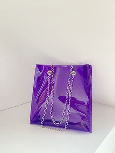 "Purple everyday bag, jelly purse, transparent tote, match day bag, handmade handbag, stadium approved bag, vegan simple design, oversize Made for order in 7 days. Dimensions: 30 x 30 x 10 cm / 12\" x12\" x 3,93\" Made of thick, crystalline, flexible PVC with big silver or gold toned chain (steel) A large handbag city , type of shopper . The modern concept of boho style , oversize . Medium transparent BAG with large , solid chain referring to my fascination with the universe transparent .You can Trendy Shoulder Bag With Transparent Straps For Daily Use, Trendy Pvc Bags For Everyday Use, Plastic Tote Bag With Clear Strap, Rectangular Shoulder Bag With Transparent Straps, Clear Pvc Bags For Daily Use, Daily Use Clear Pvc Bags, Clear Plastic Shoulder Bag For Daily Use, Trendy Rectangular Clear Plastic Bag, Trendy Clear Plastic Rectangular Shoulder Bag