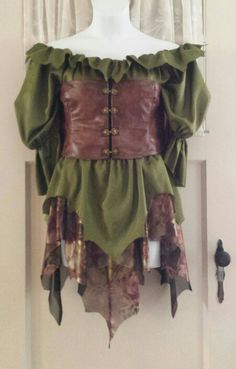 a mannequin wearing a green and brown corset