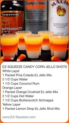 orange jello shots are lined up on a table