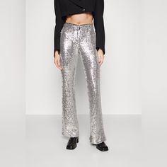 Brand New With Tags! Silver-Tone Sequin Embellishment High Waist Concealed Front Fastening Flared Imported Composition Outer: Viscose 100%, Polyester 93%, Spandex/Elastane 7% Lining: Polyester 100% Washing Instructions Hand Wash Measurements 32" Inseam, 24.5" Waist, 10.5" Rise. #23 Stretch Embellished Bottoms For Evening, Embellished Stretch Bottoms For Evening, Glamorous Embellished Bottoms For Evening, Elegant Sparkling Bottoms For Evening, High Waist Embellished Evening Bottoms, Embellished High Waist Evening Bottoms, Embellished Trousers For Party, Glamorous Embellished Evening Pants, Stretch Embellished Bottoms For Party