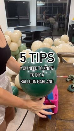 a woman holding a balloon with the words 5 tips you need to know to diy a balloon garland