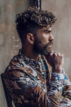 There are plenty of ways to get curly hair even if it's not your natural texture. Be it a short, medium or long haircut, you can rest assured that it’ll come out trendy and stylish. To learn how to get it as well as some hair care tips, check out our guide. #menshaircuts #menshairstyles #howtogetcurlyhair #curlymen #curlyhair #curlyhairmen Haircuts For Men With Curly Hair, Men Curly Haircut, Man Curly Hair, Curly Mens Hairstyles, Get Curly Hair, Mens Hairstyles Curly, Men's Curly Hairstyles, Men Curly Hair, Curly Styles