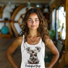 Koala clothes for yoga - yoga clothes for women Introducing the ultimate blend of comfort, style, and serenity: our Koala Yoga Tank Top for women is designed to give your yoga experience a dash of adorable flair. Crafted with the softest materials and featuring a cute print of a serene koala indulging in yoga meditation, this tank is a testament to your journey towards inner peace. Embrace your inner "koalafied yogi" as you gracefully flow through your practice. Our tank top boasts a flattering racerback design, ensuring optimal movement and breathability throughout your yoga session. The lightweight fabric gently hugs your curves, while raw edge seams add a touch of edgy charm to your ensemble. Made from a premium blend of 50% polyester, 25% combed ring-spun cotton, and 25% rayon, our tan Comfortable Relaxed Fit Activewear For Yoga, Relaxed Fit Yoga Activewear, Fitted Tank Top For Yoga, Comfortable Casual Yoga Pants, Comfortable Casual Activewear For Yoga, Comfortable Cotton Yoga Pants, Cotton Athleisure Yoga Pants, Comfortable Activewear For Yoga, Stretch Yoga Pants For Meditation In Summer