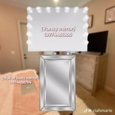 a mirror that is sitting on top of a table in front of a sign with the name vanity mirror