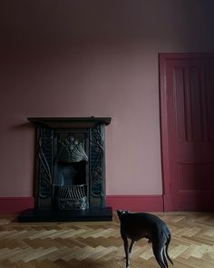 a red room with a black fireplace and dark red door frame and skirting board Red Colour Palette, Shade Of Red, Organic Wood, Red Colour, Red Barn, Bold Design, Shades Of Red, Layering