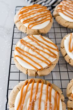 iced cookies with caramel drizzle and icing on a cooling wire rack