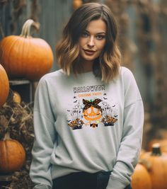 Get ready for Halloween with this uniquely designed sweatshirt featuring a pumpkin going to a party. Perfect for Halloween costume parties, this cozy sweatshirt is made for those colder months and offers a comfortable fit with top-tier durability. Ideal for those who love quirky and festive designs, this sweatshirt will add a fun touch to your wardrobe during the Halloween season. ABOUT THE PRODUCT ➤ Gildan 18000 sweatshirt made with a medium-heavy fabric blend of 50% cotton and 50% polyester (8.0 oz/yd² (271.25 g/m feels cozy and is the perfect choice for those colder months ➤ Made using 100% ethically grown US cotton ➤ Say goodbye to itchiness thanks to the gray, pearlized tear-away label SIZE ➤ Take a look at the photos to see a specific sizing chart for this sweatshirt ➤ Please note th Halloween Pumpkin Costume, Spooky October, Fall Apparel, Pumpkin Costume, Costume Parties, Halloween Party Costumes, Party Tops, Cozy Sweatshirts, Halloween Season