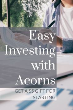 a person sitting at a table with a pen in their hand and the text easy investing with acorns get as gift for starting