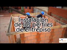 two men working on a building with the words instalcion de los perfites de entrepiso