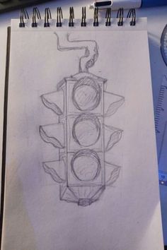 a drawing of a traffic light on paper