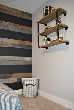 a bed room with a neatly made bed and a wooden head board on the wall