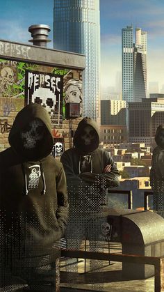 three people in black hoodies looking out over a city