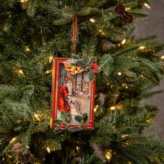 a christmas ornament hanging from the top of a tree