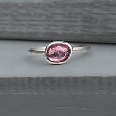 This sterling silver pink tourmaline ring is one-of-a-kind, featuring a rose cut natural tourmaline gemstone. Details: Gemstone: Genuine Rose-cut pink tourmaline 4x5mm Sterling Silver band, 2mm width Size: 7.5 US Shipping: Ready to ship within one business day Complimentary shipping in the USA Complimentary gift wrap Pink Tourmaline Sapphire Ring As Birthstone, Pink Tourmaline Ring, Tourmaline Ring, Tourmaline Gemstone, Sterling Silver Bands, Pink Tourmaline, Silver Band, Rose Cut, Gemstone Pendant