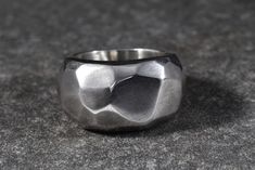 Number 18 of the series of geometric solid silver rings.  This piece has a light-brushed satin finish and as with other geometric pieces it is a unisex design. This ring is substantial and well-balanced - weighing approximately 20g - and made to a size M.  As with other heavy rings, it is advisable to go for a tight fit rather than a looser fitting. It is approximately 15mm wide at its widest point. so makes a real statement. If you have a different size in mind, please message me and we can dis Heavy Rings, Asymmetrical Ring, Ring Unique Design, Geometric Solids, Design Statement, Geometric Ring, Ring Unique, Sheffield, Unisex Design