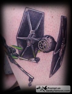 a star wars tattoo on the leg of a person