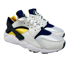 Nike Air Huarache Michigan Dd1068-107 White /Varsity Maize/Blue Retro Sizes 8-11 University Of Michigan And The Air Huaraches Are Better Known For Changing The Game With The Fab 5, But On This Navy + Maize Low Top Edition, The University's Colors Hit The Og Version Of The Nike Air Huarache. With White Leather Overlay, The Navy And Yellow Bootie Sock Ensures A Snug Fit. A Classic White Midsole Hits The Model That Has Been In Demand For Decades. Style Code: Dd1068-107 Color: White /Varsity Maize/B Urban White Custom Sneakers With Vibram Sole, White Urban Custom Sneakers With Vibram Sole, White Urban Sneakers With Vibram Sole, Sporty White Lace-up Huaraches, Casual Low-top Leather Huaraches, Casual Huaraches With Cushioned Footbed For Streetwear, Casual Leather Low-top Huaraches, White Lace-up Huaraches For Streetwear, Nike Sporty White Huaraches