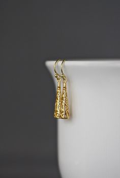 "Beautifully detailed 14k shiny gold vermeil filigree long drop charms simply dangle from 18k gold vermeil balled earwires. These incredibly lightweight go-with-everything earrings complete any outfit for daytime or evening. Gold charms: 6x25mm Total length of earrings: almost 1 1/2\" These earrings are also available in silver... www.etsy.com/listing/601324485/silver-filigree-earrings As the owner, maker, designer, and curator of this shop, I take great pride in providing you with jewelry that Elegant Gold Plug Earrings In Brass, Classic Gold Chandelier Earrings For Anniversary, Elegant Yellow Gold Plated Plug Earrings, Yellow Gold Dangle Plug Earrings For Formal Events, Elegant Yellow Gold-plated Plug Earrings, Elegant Gold Linear Brass Earrings, Elegant Gold Chandelier Earrings In Sterling Silver, Elegant 22k Yellow Gold Plug Earrings, Elegant Gold Teardrop Plug Earrings