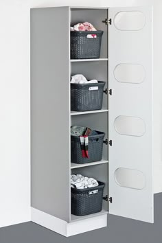 a closet with several baskets and clothes on the shelves next to it is shown in this image