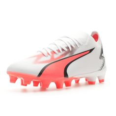 a white and red soccer shoe with spikes on the bottom, in front of a white background