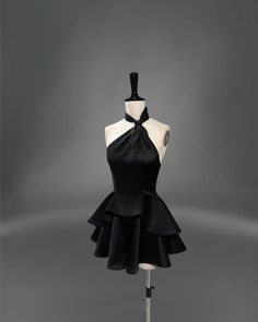 a mannequin with a black dress on it