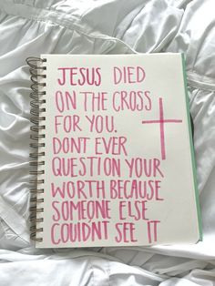 a note book with the words jesus died on the cross for you, don't ever question your worth because someone else couldn set it