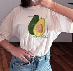 Avocado Graphic T-shirt | Fruit Graphic Shirt, Avocado Tee, Avocado illustration, Vintage fruit, Fruit Vintage, Summer shirt, Gift For Her 🍃 Wild Aesthetic 🍃 -All Printed on 100% Soft Ringspun Cotton  -First Class Delivery UK  -UK based -Message for bundle discounts and customs.  Find sizing guide in the listing photos. Available in S  M  L XL Avocado Tshirt Design, Fruit Design Graphic Tee With Crew Neck, Graphic Tee With Fruit Design And Crew Neck, Crew Neck Fruit Design Graphic Tee, Crew Neck Graphic Tee With Fruit Design, Green Graphic Tee With Fruit Print, Avocado Graphic, Avocado Illustration, Wild Aesthetic