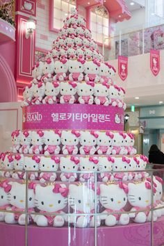 there are many hello kitty cupcakes on display in the store's lobby