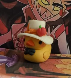 a rubber duck wearing a hat and bow tie