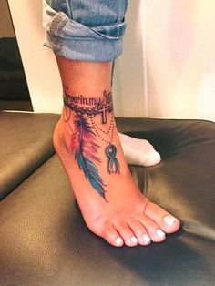 a woman's foot with a tattoo on it