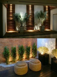 some plants are growing in pots on the floor and next to a wall with lights